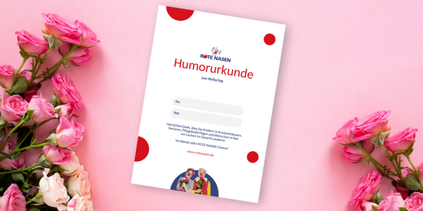 Bild von der Spendenurkunde mit Rosen links und rechts im Bild
